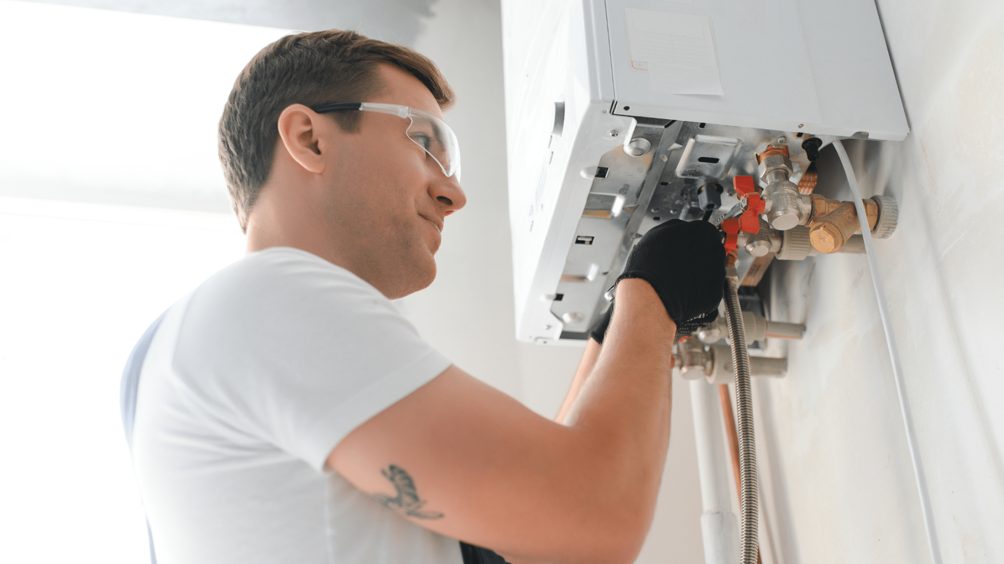 Contractor checking electrical panel and HVAC equipment for a home expansion project